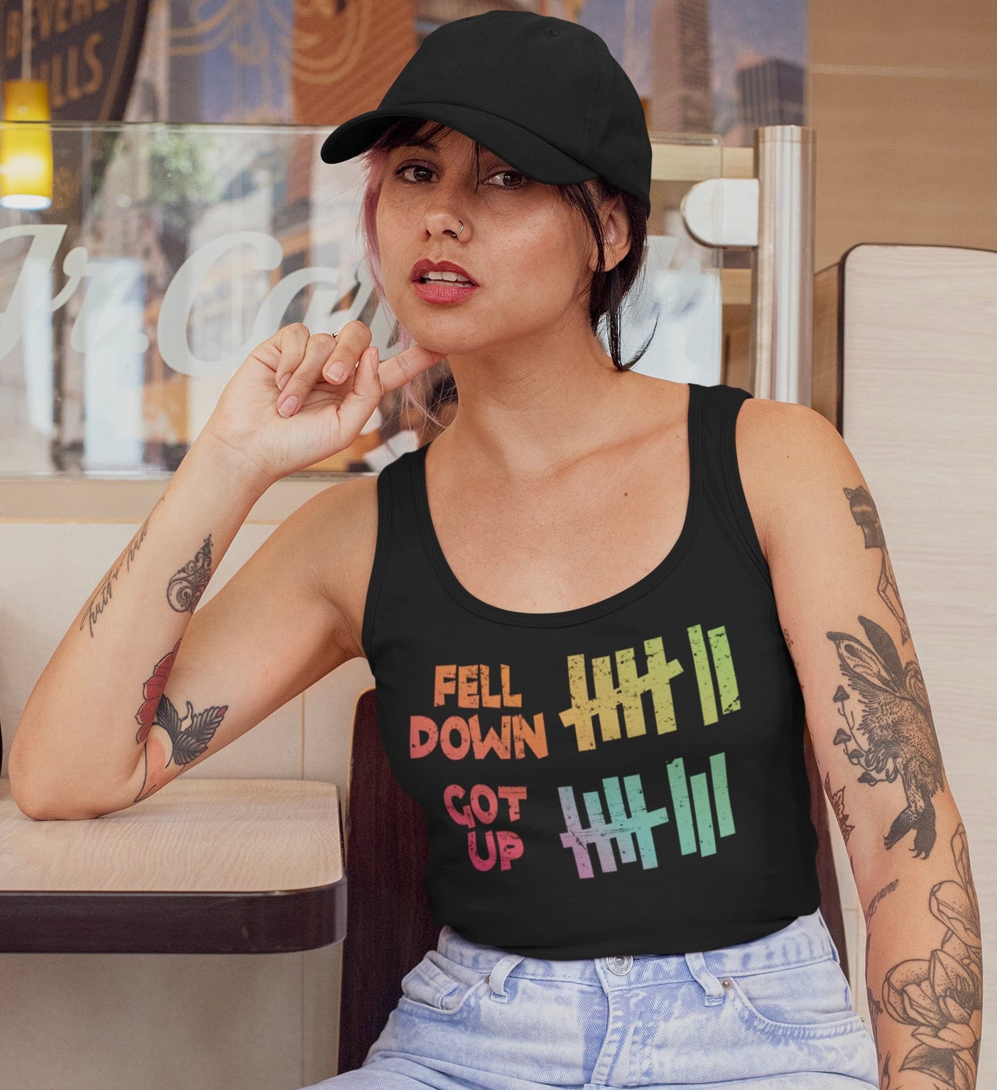 Resilience looks good on you — especially in our “Fell Down, Got Up” Pride Tank Top.